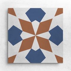 an abstract tile design with blue, brown and white shapes on the bottom right corner