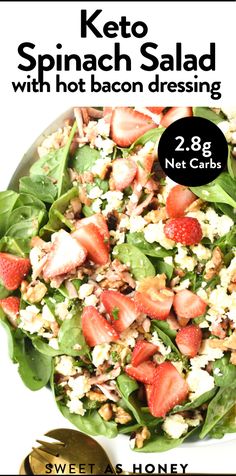 a salad with spinach and strawberries in it