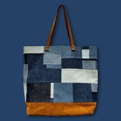 a blue and brown tote bag on a blue background