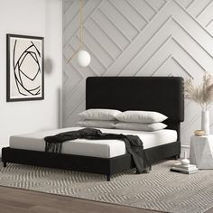 a black and white bed in a modern bedroom