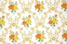 an orange and yellow rose pattern on a white wallpaper with green leaves in the background