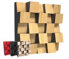 a wooden wall with several different colored squares on it and one is black, the other is white