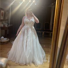 a woman taking a selfie in a wedding dress