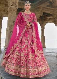 Traditional Bridal Rani Pink Silk embroidered lehenga choli AA137Desc: Style : Circular Lehenga Color : Rani Pink Fabric : Silk  Work :Haevy Embroidery Wash Care : Dry clean Sleeve Style : Half Sleeve Long Sleeves : Done only in Custom Stitch Sleeves Lining : Done only in Custom Stitch Bust Size : 32 to 42 Inches Occasion : Wedding Mehendi Engagement Reception Ceremonial Baby Shower Party Wear:Semi stitch lehenga choli.Size till 42 inch.heavy bridal lehenga choli Pink leheng...