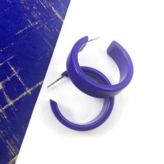 Cobalt Blue opaque lucite hoop earrings in a straight & sturdy shape with a shiny cobalt finish anda purple hue. This style is known as the 'Chandler Hoop' (formerly known as the Small Portland Hoop) and comes in 2 sizes. The larger one is the Portland Hoop. This is the smaller of the 2, but is in no way a small hoop. It measures about 30mm or 1.25" in diameter & 10mm in width. One of our favorite styles & comes in many colors. Jewelry is designed & hand finished by us, here in t Modern Small Hoop Earrings In Plastic, Modern Plastic Hoop Earrings, Modern Small Hoop Plastic Jewelry, Modern Plastic Hoop Jewelry, Trendy Plastic Hoop Earrings, Trendy Small Hoop Plastic Earrings, Modern Small Hoop Plastic Earrings, Modern Plastic Hoop Earrings For Gifts, Modern Plastic Hoop Earrings As Gift