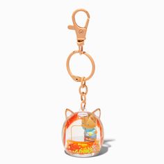 a keychain with a cat inside of it on a white background and an orange fish bowl in the middle