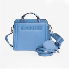 Steve Madden Beverlyn cornflower blue Casual Blue Satchel For Daily Use, Trendy Blue Rectangular Shoulder Bag, Casual Blue Satchel Shoulder Bag, Casual Blue Shoulder Bag Satchel, Light Blue Travel Bag With Removable Pouch, Casual Blue Shoulder Satchel, Trendy Light Blue Shoulder Bag With Double Handle, Light Blue Rectangular Bag With Adjustable Strap, Trendy Light Blue Double Handle Shoulder Bag