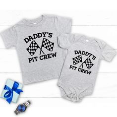 This cute graphic outfit is great for the new dad, Birthday, Father's Day, Christmas or to be or just cute everyday wear for your child. Such a cute outfit for your mini pit crew. These can be customized in your choice of vinyl color as shown, the black and white vinyl colors are standard. Garments come in three colors Onesies® & T-Shirts come in a variety of sizes of your choice. We use high quality, soft flex vinyl which not only creates a sharp, vivid graphic but will never look "faded" or “w Playful Short Sleeve Tops For Father's Day, Father's Day Playful Short Sleeve T-shirt, Playful Crew Neck T-shirt For Father's Day, Father's Day Playtime T-shirt With Short Sleeves, Father's Day Short Sleeve Playtime T-shirt, Father's Day Playtime T-shirt Short Sleeve, Cute Black T-shirt For Father's Day, Black Crew Neck Top For Gender Reveal, Black Family Matching T-shirt For Playtime