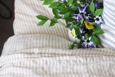 a bouquet of flowers sitting on top of a bed