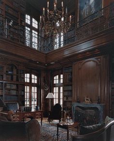 a living room filled with furniture and a chandelier