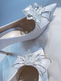 Bridal bow heels are a type of shoe that is specifically designed for a bride to wear on her wedding day. The bow is often made of the same material as the shoe and can be adorned with sparkling crystals or other embellishments to add a touch of glamour and femininity to the bridal ensemble. These shoes are a romantic and playful option for a bride who wants to add a touch of whimsy to her wedding day look. Crystal chain embellishment lampskin Pointed toe Stiletto heel Heel height measures: 60mm Bridal Bow, Handmade Jewlery, Crystal Heels, Bridal Heels, Bow Heels, Crystal Chain, White Crystal, Crystal Embellishment, Romantic Style