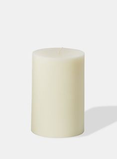 a white candle with a single flame