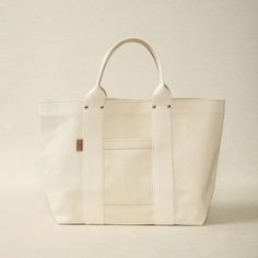 Heavy weight natural unbleached canvas tote 21.6" x 7" x 13" Made in Japan White Cotton Canvas Bag For Weekend, White Canvas Weekend Bag, Natural Canvas Tote Bag With Canvas Lining, Eco-friendly White Canvas Bag With Canvas Lining, Large Beige Canvas Bag, Eco-friendly White Canvas Bag, White Canvas Bag For The Weekend, Cream Canvas Bag With Canvas Lining, Classic Cotton Canvas Bag For Daily Use