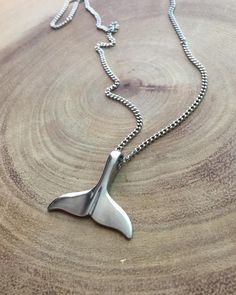 "Elegant stainless steel whale tail pendant. The beauty in details. Perfect gift for an ocean lover Pendant size : 1 inch  Chain length : 20 inch  Need a different length just write it to me in the \"message to the seller\" box of the order form. **LIMITED SUPPLY** All of our jewelry comes wrapped and ready for gift giving! To see more, please visit my shop at http://www.etsy.com/ca/shop/BadassjewelryToronto" Whale Tail Jewelry, Whale Tale, Dolphin Tale, Hand Carved Jewelry, Silversmithing Jewelry, Coin Art, Ocean Jewelry, Nautical Jewelry, Silver Signet Ring