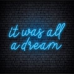 it was all a dream neon sign on brick wall