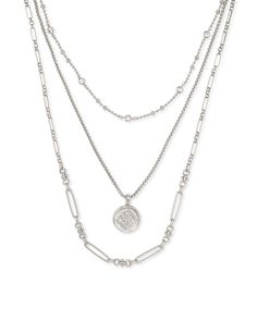 Accentuate your look with this stylish Medallion Triple Strand Necklace. It features three strands of delicate chains, adorned with a medallion in the center. Its elegant design is sure to add a touch of sophistication to your ensemble. Layered Necklaces Silver, Medallion Necklace, Multi Strand Necklace, Brass Metal, Strand Necklace, Multi Strand, Kendra Scott, Layered Necklaces, Vintage Gold