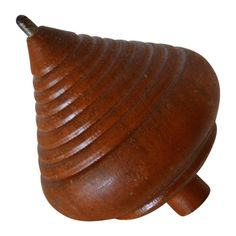 a wooden object is shown on a white background