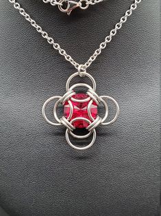 The birthstone tradition traces its roots back to ancient times, and has been found in several cultures worldwide. Garnet is recognized as the birthstone for January. While garnets can range in color from red, to yellow, to green, the most common color is a deep red, and this siam Swarovski captures its hues perfectly. Wearing the gemstone associated with your birth month is purported to bring good fortune, though it can simply make a thoughtful gift! Matching earrings available. This completed Handmade Ruby Jewelry For Gift, Fusion Style Metal Jewelry For Gifts, Fusion Style Stone Setting Jewelry Gift, Traditional Red Round Pendant Jewelry, Nickel Free Red Jewelry As Gift, Nickel Free Red Jewelry Gift, Fusion Style Necklace With Stone Setting As Gift, Nickel-free Ruby Jewelry For Gifts, Nickel-free Ruby Jewelry Gift