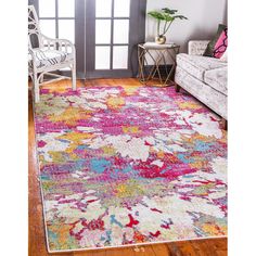 a brightly colored area rug in a living room