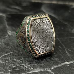 Embroidered Surah Al-Inshirah Silver Ring, Silver Islamic Turkish Handmade Ring , Arabic Writing Thumb Ring , Ottoman Style , Gift For Him , Same Day For Shipping ✧ Product Details * Handmade İtem * Gender : Male / Female * Material : 925K Sterling Silver * Ring Weight : 19 Grams * Gemstone Type : Green Zircon ✔ Usage Details * Silver jewelry is very sensitive to chemicals. It is recommended to keep away from chemical substances such as cream, bleach, deodorant, detergent. * Silver jewelry can also darken quickly in salt water, that is, in sea water. For this reason, it is best to remove them when swimming in the sea. ✔ Shipping * Your orders placed on weekdays are delivered to the cargo on the same day. Your orders placed on the weekend are delivered to the cargo on Monday. ✔ Other Detail Traditional Gold Emerald Ring As Gift, Traditional Gold Emerald Ring For Gift, Gold Emerald Ring Hand Set As A Gift, Ceremonial Spiritual Engraved Ring With Intricate Design, Traditional Engraved Ring As Gift, Traditional Engraved Ring For Gift, Traditional Silver Signet Ring With Intricate Design, Traditional Silver Signet Ring For Ceremonial Use, Traditional Handmade Silver Rings