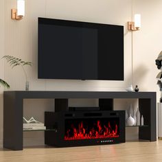 a television stand with a fire place in front of it