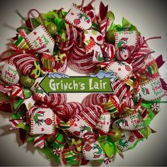 a wreath made out of candy canes with the words grin's fair on it