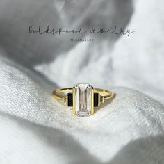 a close up of a ring on a white cloth