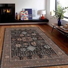 a living room with a fireplace and rug on the floor