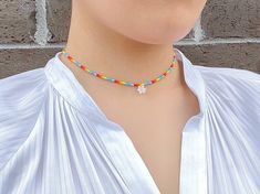 "This chic, colorful but simple necklace will add an extra ✨ to your everyday style. You can layer it with your favorite accessory or wear it on its own! P R O D U C T * D E T A I L S Materials :: premium seed beads, gold-plated clasp Chain Length :: 14\" / 16\" / 18\" C A R E * I N S T R U C T I O N S Please remember that all our jewelry is handmade, so handle it with care and love. Also note that gold or silver-colored pieces may tarnish over time depending on the frequency of use and care taken when using the items. To prolong the life of these pieces, we strongly advise storing them separately, away from direct sunlight and moisture, and avoid wearing them near water. Handcrafted by FOR MY MUSE" Casual Beaded Necklaces For Spring Gift, Casual Beaded Necklace For Spring Season Gift, Casual Flower-shaped Beaded Necklaces, Casual Flower-shaped Beaded Necklace As Gift, Casual Spring Jewelry With Tiny Beads, Multicolor Spring Choker Jewelry, Multicolor Choker Jewelry For Spring, Multicolor Choker For Spring, Spring Multicolor Choker Jewelry