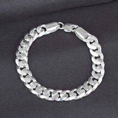 925 Silver Bracelet. Wt 50 Gms Classic Silver Charm Bracelet For Everyday, Classic Silver Chain Bracelet With Polished Finish, Classic Silver Chain Charm Bracelet, Classic White Gold Charm Bracelet With Silver Chain, Classic Charm Bracelet With Sterling Silver Clasp, Classic Silver Charm Bracelet, Classic Silver Cuban Link Bracelet With Polished Finish, Silver Cuban Link Jubilee Bracelet For Everyday, Classic Silver Jubilee Chain Bracelet