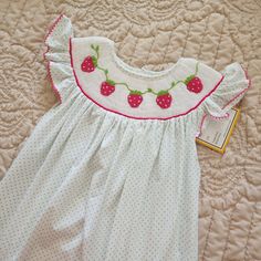 Nwt Babeeni Smocked Dress Cute Smocked Strawberry Mint Length 31" Strawberry Baby Dress, Playful Cotton Smocked Dress, Playful Cotton Smocked Dress With Smocked Back, Cute Cotton Smocked Dress With Smocked Cuffs, Cute Smocked Dress With Smocked Back For Playtime, White Cotton Smocked Dress With Ruffles, Playful White Embroidered Dress, Cute Sleeveless Dress With Smocked Cuffs, Playful White Dress With Smocked Back