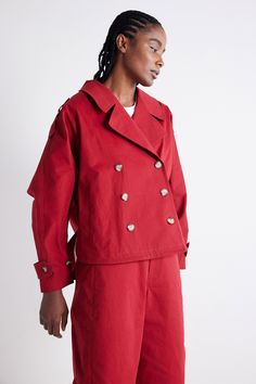 This oversized take on the Trench Coat coat is the perfect combination of practical and stylish, especially as a transitional coat from Summer to Fall. A stunning layering piece and effortless style statement. Double breasted Classic collar Button down closure Oversized Utility Outerwear With Lapel Collar, Utility Oversized Outerwear With Lapel Collar, Oversized Solid Utility Jacket For Work, Cotton Double-breasted Outerwear For Work, Red Double-breasted Outerwear For Fall, Spring Cotton Double-breasted Outerwear, Chic Red Oversized Outerwear, Red Single Breasted Cotton Outerwear, Cotton Double-breasted Outerwear With Lapel Collar