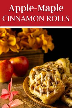 apple - maple cinnamon rolls on a plate with apples in the background and text overlay