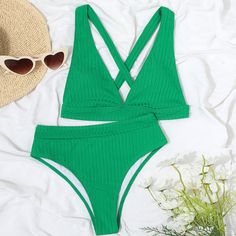 This most-wanted bikini set is a perfect way to highlight the sea tan! The ribbed two piece swimsuit features an ultra-supportive swim top with a deep v neckline, removable soft padding cups for comfort, suspender shoulder straps for a flattering fit, tie straps to the rear to create a criss-cross effect, and the matching mid-waist bikini bottom provides a cheeky back coverage to elongate your figure.Size (in)BustWaistHipS352430M362631L382833 Plus Swimwear, Two Piece Swimsuit, Figure Size, Swim Top, Tie Backs, Tie Back, Deep V, Criss Cross, Shoulder Straps