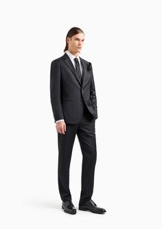 Find EMPORIO ARMANI Soho Line Single-breasted Suit In Wool And Cashmere on Editorialist. This sophisticated Soho line suit unites tailoring tradition with exquisite, refined fabrics that highlight the modern look of the garment. Slim-fit jacket with notched lapels, a breast pocket and welt pockets. Single-breasted two-button fastening. The trousers have a classic line, a belt with loops, and a concealed zip and button closure. Elegant Silk Blazer With Welt Pockets, Designer Tailored Tuxedo For Workwear, Tailored Luxury Three-piece Suit For Work, Luxury Tailored Three-piece Suit For Work, Luxury Slim Fit Three-piece Suit For Work, Elegant Silk Suits For The Office, Elegant Silk Suit For Office, Elegant Silk Blazer For Business Casual, Elegant Silk Office Suit