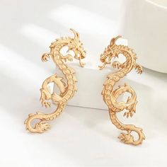 Experience The Captivating Allure Of These 2.5 In (65mm) Dragon Statement Earrings. These Exquisite Earrings, Available In Matte Gold And Silver, Feature An Intricate Asian Dragon Design That Will Add A Touch Of Boldness To Any Outfit.