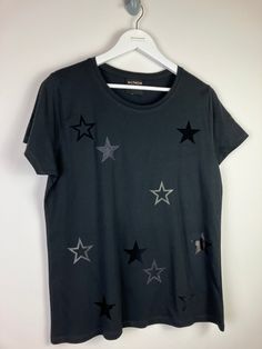 All the stars t-shirt - statement star print - customisable - Handmade  One of our favourite t-shirts which is covered in large stars; a full star and a cut out star, and with two smaller versions placed onto each sleeve. Fully customisable to have matt, metallic, flock or glitter! Matt: white, grey, cherry red, black, navy, green, baby pink, baby blue, raspberry, mint, orange, lemon yellow, lilac, purple Matt Neon: pink, red, yellow, orange, blue, green Metallic: rose gold, matt gold, matt silv Black Crew Neck Top With Star Patch, Black Crew Neck T-shirt With Star Patch, Yellow Lilac, Penguin T Shirt, Star T Shirt, Uk Size 16, Metallic Pink, Great T Shirts, Lemon Yellow