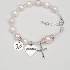 "> Want to tell her that you would like her to be the Godmother of your child? > Do you need the perfect gift for the Godmother you've already asked to give at Baptism? This elegant Swarovski crystal rosary bracelet would be the perfect gift for the Godmother of a baby girl. Available in sizes small, regular, and large. Includes a sterling silver extender chain as shown. If you choose the small size, I will use a smaller crystal in between each bead - all of the 10 Hail Mary beads will sti Baby Girl Baptism, Godparent Gifts, Baby Pearls, Rosary Bracelet, Baptism Girl, God Parents, Pink Bracelet, Godmother, Crystal Pearls