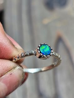 This blue-green Australian opal ring is a size 6, cannot be resized. Wear as a dainty piece or stack to make a statement Stackable Opal Promise Ring, Fine Jewelry Stackable Opal Promise Ring, Stackable Opal Promise Ring In Fine Jewelry Style, Opal Gemstone Stackable Round Rings, Opal Gemstone Stackable Rings, Unique Stackable Opal Ring As Gift, Handmade Opal Promise Ring, Stackable Opal Gemstone Rings, Stackable Open Opal Ring In Fine Jewelry Style