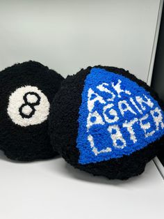 two black and blue balls with numbers on them