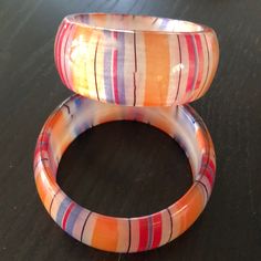 Striped Acrylic Bracelets Apx. 1.25” Wide. Great Paired Together Or With Others! Priced Per Bracelet. Adjustable Orange Bangle As Gift, Adjustable Orange Bangle For Gift, Vibrant Red Bracelets For Gift, Retro Multicolor Bracelet Jewelry, Trendy Orange Plastic Jewelry, Multicolor Retro Bracelets For Gift, Multicolor Retro Bracelet For Gift, Retro Multicolor Bracelets For Gift, Retro Multicolor Bangle Bracelets