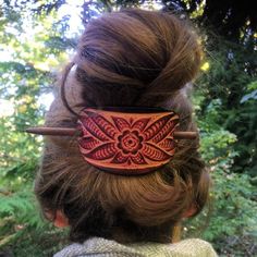 Harness the power of the leather flower and infuse your life with a does of hippie nostalgia! For floral blooms that won't wilt and a timeless hair style that will keep you feeling groovy, look no further. We're happy to craft the barrettes in other colors so shoot us a message if interested :)    Made from Full-Grain American Leather.    Secure in hair with durable wooden barrette stick (extra stick included with order).    Large Barrette measures 2’’ high by 3'’ wide from inside of holes (idea Leather Trinkets, Leather Hair Barrette With Stick, Leathercraft Ideas, Large Barrette, Leather Hair Clips, Timeless Hair, Maleficent 2, Salted Granola, Hair Bling