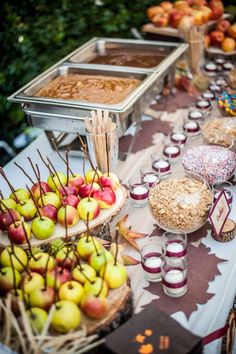 a table topped with lots of food next to a cupcakes and muffins