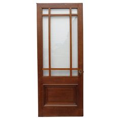 a wooden door with glass panels on the top and bottom panel, against a white background