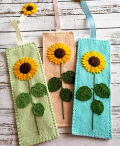 three felt bookmarks with sunflowers on them