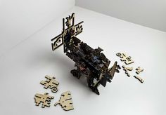 a group of wooden pieces sitting on top of a white table next to each other