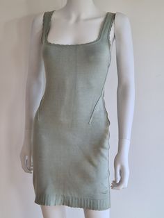 "Alaïa Spring/Summer 1992 stretch jersey sleeveless mini dress, scalopped knit neckline and hem, neckline sitting low across the bust. The colour is a beautiful seafoam, between pale blue and green. The knit is made to hug and exaggerate your every curve. Inspired by Versailles and the Marquise of Pompadour, Azzedine Alaïa's Spring 1992 iconic collection introduced pastel colours (pale blue, pale green, pink...) into the chromatic world of the meticulous craftsman. A demonstration of technical s Green Square Neck Tank Top For Spring, Green Fitted Square Neck Tank Top, Green Stretch Mini Dress With Square Neck, Summer Stretch Mini Dress With Square Neck, Green Fitted Mini Dress With Scoop Neck, Fitted Green Mini Dress With Scoop Neck, Fitted Green Dress With Scoop Neck, Scoop Neck Stretch Sleeveless Summer Dress, Fitted Sleeveless Dress With Scoop Neck For Spring