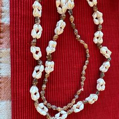 Natural Seashell Cluster Lariat Strand Necklace From Hawaii Nwot White Adjustable Lariat Jewelry, Long Beaded Necklaces For Beach, Adjustable Multi-strand Jewelry For Beach, Handmade Long White Necklace, Vintage Brown Jewelry For The Beach, White Long Necklace In Costume Jewelry Style, White Shell-shaped Necklace, White Long Costume Jewelry Necklace, White Single Strand Long Necklace As Gift