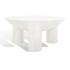 a white table sitting on top of a white floor