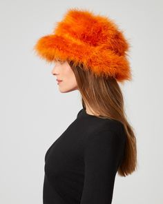 Luxurious marabou feathers find a new home in this bucket hat. Not only does it keep you warm in cooler months, it makes a stylish addition to brunch or lunch on the town. Marabou Feathers, Jumpsuit Jacket, Outerwear Vest, Fall Collections, Skirt Pants, Sweater Skirt, Jacket Tops, Sweater Top, Feathers